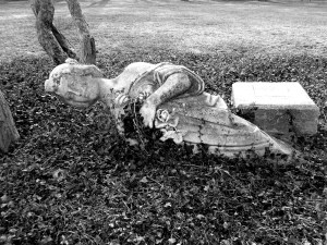 Toppled statue in Guggenheim garden. The face is believed to be modeled after Leonie Guggenheim. 