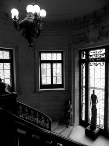 Angled down from one of two swooping stairwells from second floor down to main level. 