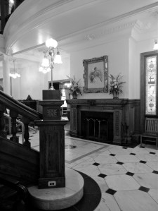 Fireplace at the base of the first floor stairwell. 