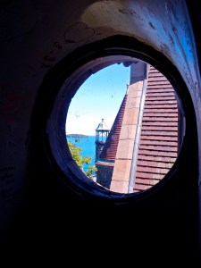 Porthole view from castle tower. St. Lawrence River in the background. 